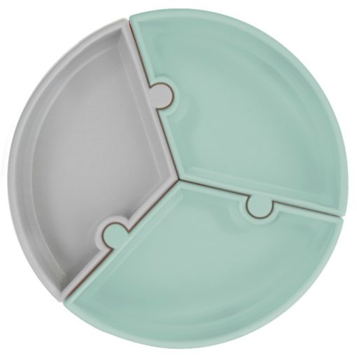 Assiette puzzle Minikoioi en silicone pour bébés dès 6 mois et toute l’enfance. Sa base à ventouse la gardera bien accrochée à la table. Disponible au Maroc chez MESAYOU. De marque MINIKOIOI qui est une marque d'accessoires pour bébé en silicone sans BPA et de très bonne qualité