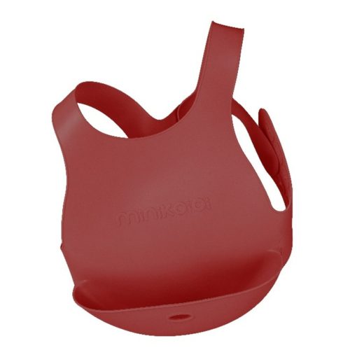 Bavoir avec système d'attache au dos de marque Minikoioi en silicone pour bébés dès 6 mois et toute l’enfance. Souple et facilement transportable, il accompagnera votre bébé durant ses premiers repas et préservera ses habits.